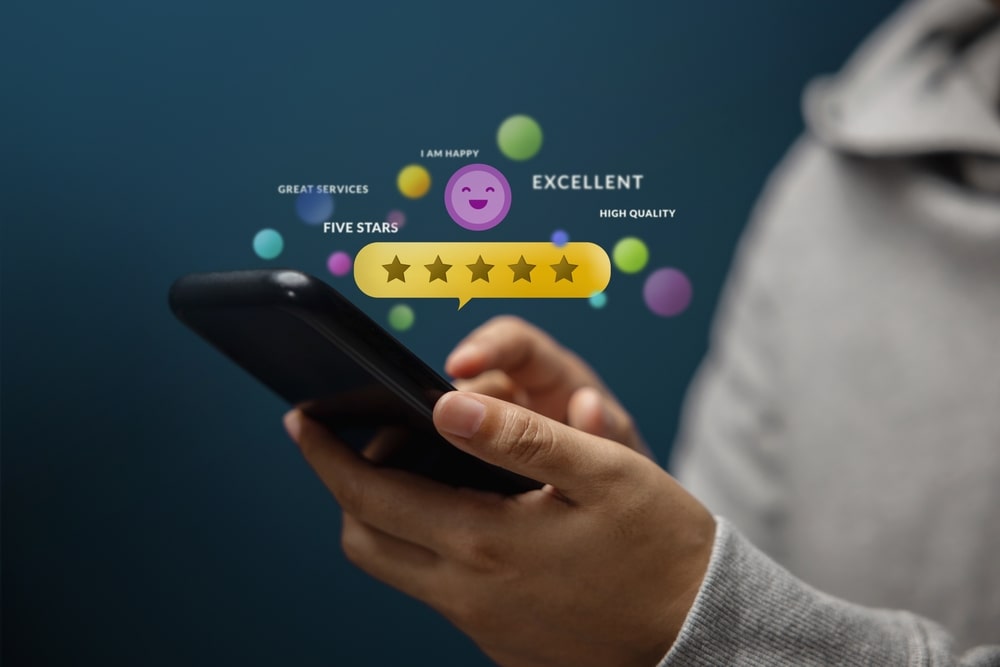 Client Using Smartphone to Review Five Star