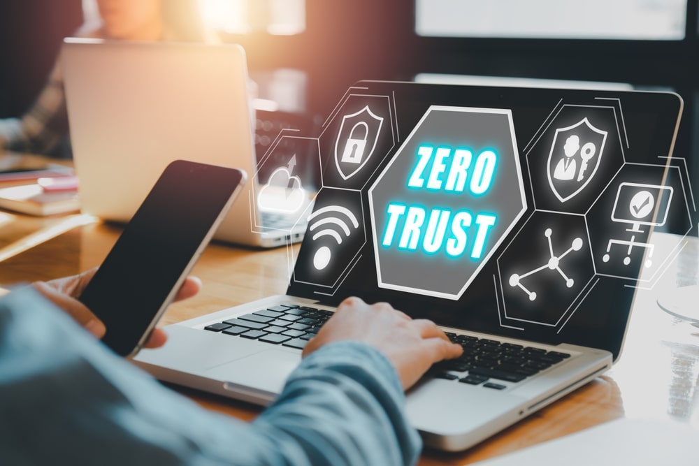 person on laptop with zero trust security